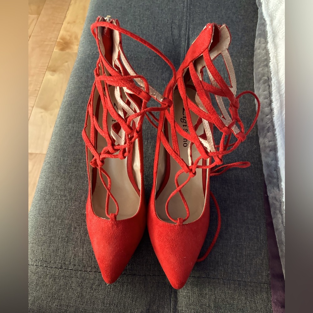 Red suede tie up high heels.